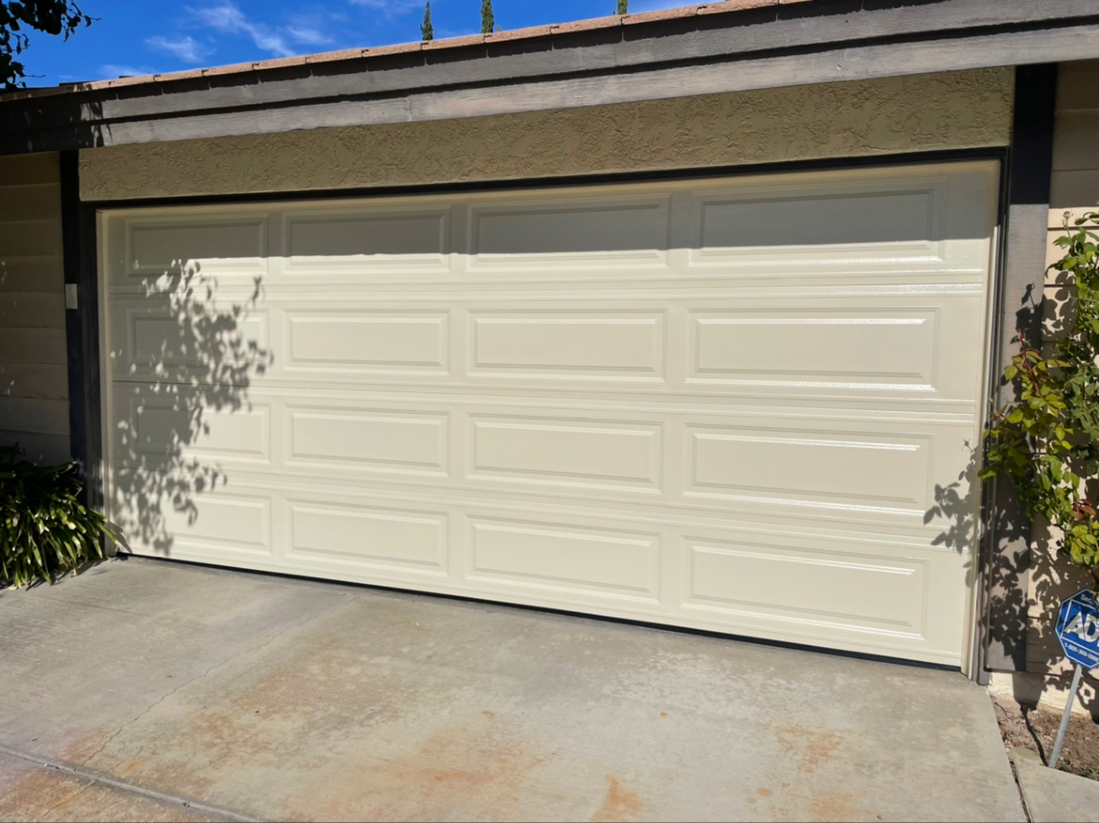 Torsion shaft, springs, and LiftMaster opener installed on a residential garage by DoorWorks