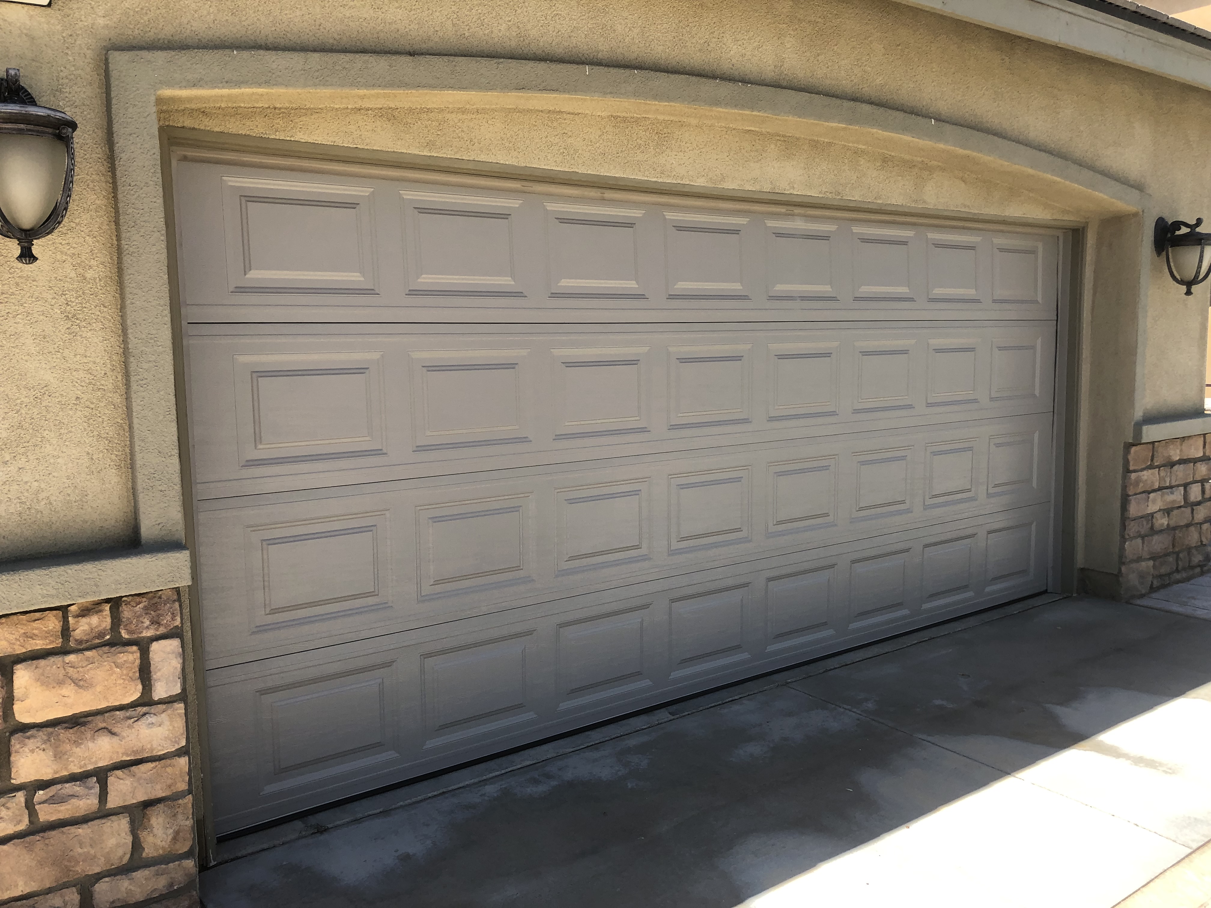 Finished carriage-style garage door installation by DoorWorks on a Lancaster home
